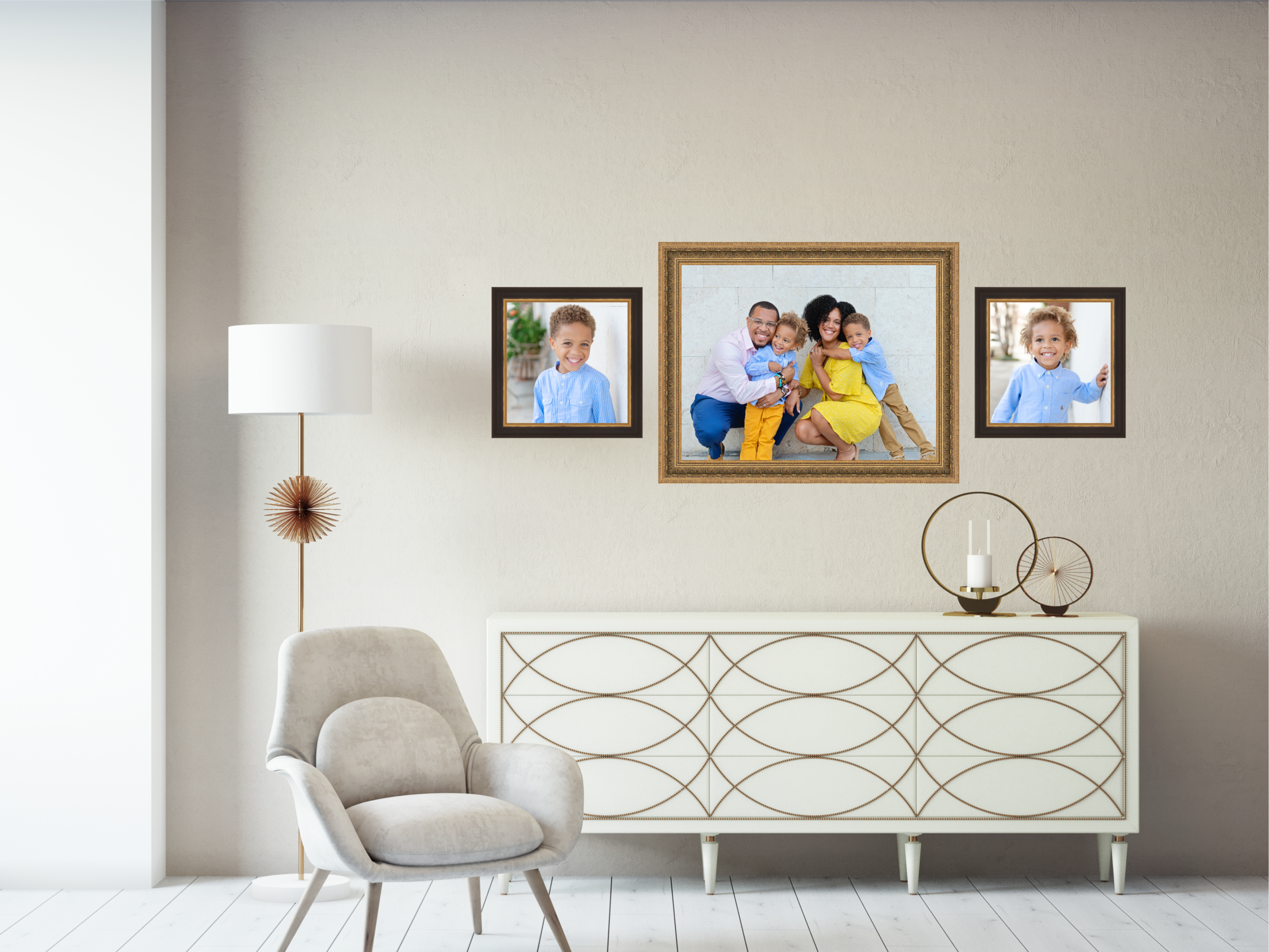 A stylish living room featuring a custom wall gallery of family portraits by Simply Shelby Photography.